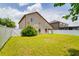Spacious fenced backyard with lush lawn, ideal for outdoor activities and relaxation at 18508 Merseyside Loop, Land O Lakes, FL 34638