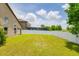 A spacious backyard surrounded by a white privacy fence, providing a secure and serene outdoor space at 18508 Merseyside Loop, Land O Lakes, FL 34638