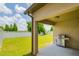 Covered patio with a grill, offering a perfect outdoor space for entertaining or relaxing at 18508 Merseyside Loop, Land O Lakes, FL 34638