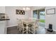 Cozy dining area with modern chandelier, table, and chairs, perfect for Gathering meals at 18508 Merseyside Loop, Land O Lakes, FL 34638