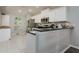 Spacious kitchen boasts stainless steel appliances, ample counter space, and natural light at 18508 Merseyside Loop, Land O Lakes, FL 34638