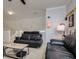 Cozy living area with modern sofas, a coffee table, and stylish decor at 18508 Merseyside Loop, Land O Lakes, FL 34638