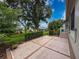 Well-maintained backyard with landscaping, a patio, and easy access to the home at 18549 Grand Club Dr, Hudson, FL 34667