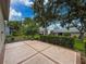 Lush backyard with mature landscaping and a patio, offering a private outdoor space at 18549 Grand Club Dr, Hudson, FL 34667
