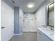 Bathroom showcasing a walk-in shower with white subway tile and a modern vanity at 18549 Grand Club Dr, Hudson, FL 34667
