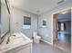 Bathroom featuring double sinks, ample counter space, and modern fixtures and finishes at 18549 Grand Club Dr, Hudson, FL 34667