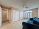 Bedroom featuring laminate flooring, closet storage, and large windows with shutter coverings at 18549 Grand Club Dr, Hudson, FL 34667