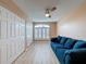 Bedroom with laminate flooring, closet storage, and large windows with shutter coverings at 18549 Grand Club Dr, Hudson, FL 34667