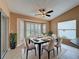 Inviting dining area with bay window, neutral tones, and plenty of natural light at 18549 Grand Club Dr, Hudson, FL 34667