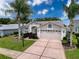 Charming single Gathering home with a 2-car garage and neatly maintained front yard at 18549 Grand Club Dr, Hudson, FL 34667