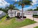 Charming single Gathering home featuring lush landscaping, and a two car garage at 18549 Grand Club Dr, Hudson, FL 34667