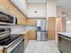 Well-equipped kitchen boasts stainless steel appliances and ample cabinet storage for organization at 18549 Grand Club Dr, Hudson, FL 34667