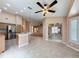 Bright kitchen features stainless steel appliances and a center island with bar seating at 18549 Grand Club Dr, Hudson, FL 34667