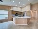 Modern kitchen features a large island, stainless steel appliances, and recessed lighting at 18549 Grand Club Dr, Hudson, FL 34667