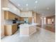 Open-concept kitchen with an island, stainless steel appliances, and ample counter space at 18549 Grand Club Dr, Hudson, FL 34667