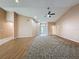 Expansive living area featuring vaulted ceilings, wood flooring, and ample space for furniture arrangement at 18549 Grand Club Dr, Hudson, FL 34667