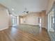 Spacious living room with high ceilings, wood floors, neutral paint, and multiple doorways to other areas of the home at 18549 Grand Club Dr, Hudson, FL 34667