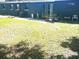 Expansive backyard, patio area with chairs, providing a relaxing outdoor retreat at 2010 Warrington Way, Tampa, FL 33619