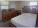 Bedroom featuring wood furniture, bright light, and space for storage at 2010 Warrington Way, Tampa, FL 33619
