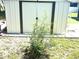 A shed in the yard that offers extra storage space at 2010 Warrington Way, Tampa, FL 33619