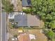 Aerial view of the property showcasing the house, driveway, yard, and surrounding neighborhood at 2108 E Linebaugh Ave, Tampa, FL 33612