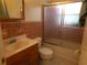 Functional bathroom with a tiled shower enclosure, neutral fixtures, and a tidy vanity area at 2239 Curtis S Dr, Clearwater, FL 33764