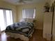 Inviting bedroom with a cozy bed, ample natural light, and wood flooring, great for relaxation at 2239 Curtis S Dr, Clearwater, FL 33764
