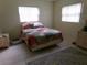 Comfortable bedroom with neutral walls, tiled floor, natural light, and classic furnishings at 2239 Curtis S Dr, Clearwater, FL 33764