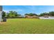 Large, green backyard is fully fenced, offering privacy and ample space for recreation at 243 Chardonnay Pl, Valrico, FL 33594