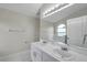 Bathroom featuring a large mirror over double sinks and a bathtub at 243 Chardonnay Pl, Valrico, FL 33594
