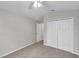 Bedroom features a closet, ceiling fan, neutral paint, and carpet at 243 Chardonnay Pl, Valrico, FL 33594