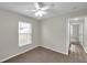 Bedroom features a window with blinds, ceiling fan, and neutral paint at 243 Chardonnay Pl, Valrico, FL 33594