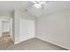 Bedroom features a closet, ceiling fan, neutral paint, and carpet at 243 Chardonnay Pl, Valrico, FL 33594