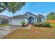 Charming single-story home features a two-car garage and well-maintained landscaping at 243 Chardonnay Pl, Valrico, FL 33594