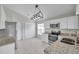 Well-lit kitchen features tile floors, stainless appliances, and granite countertops at 243 Chardonnay Pl, Valrico, FL 33594
