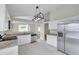 Renovated eat-in kitchen featuring granite countertops and stainless steel appliances at 243 Chardonnay Pl, Valrico, FL 33594