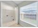 Laundry room with tile floors, storage and window at 243 Chardonnay Pl, Valrico, FL 33594