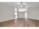 Spacious living room features vaulted ceiling, ceiling fan, and updated flooring at 243 Chardonnay Pl, Valrico, FL 33594