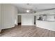 Spacious living room with wood floors, high ceiling, and open access to the kitchen at 243 Chardonnay Pl, Valrico, FL 33594
