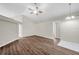 Spacious living room features vaulted ceiling, ceiling fan, and updated flooring at 243 Chardonnay Pl, Valrico, FL 33594