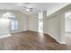Spacious living room features wood floors, a ceiling fan, and abundant natural light at 243 Chardonnay Pl, Valrico, FL 33594