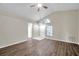 Spacious living room features vaulted ceiling, ceiling fan, and updated flooring at 243 Chardonnay Pl, Valrico, FL 33594