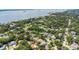 Beautiful aerial view of a residential area, showcasing lush greenery and proximity to the waterfront at 245 Grove Cir N, Dunedin, FL 34698