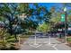 Dunedin trail featuring benches, trees, landscaping, and walking path at 245 Grove Cir N, Dunedin, FL 34698