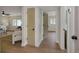 Hallway featuring wood floors and paneled doors provides access to other rooms in the house at 245 Grove Cir N, Dunedin, FL 34698