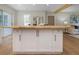 Kitchen island with wood countertop and white cabinetry, providing extra storage and workspace at 245 Grove Cir N, Dunedin, FL 34698