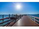 Scenic pier view of the Dunedin harbor. Calm water and sunny blue sky at 245 Grove Cir N, Dunedin, FL 34698