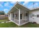 Relaxing screened porch, perfect for enjoying the outdoors in comfort and privacy at 245 Grove Cir N, Dunedin, FL 34698