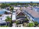 Aerial view of a well-maintained home surrounded by lush greenery and neighborhood streets at 2504 W North A St # A, Tampa, FL 33609