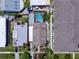 An aerial view of a home with a backyard pool, surrounded by neighboring houses and lush greenery at 2504 W North A St # A, Tampa, FL 33609